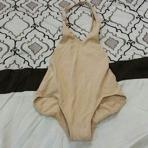 Tan body suit